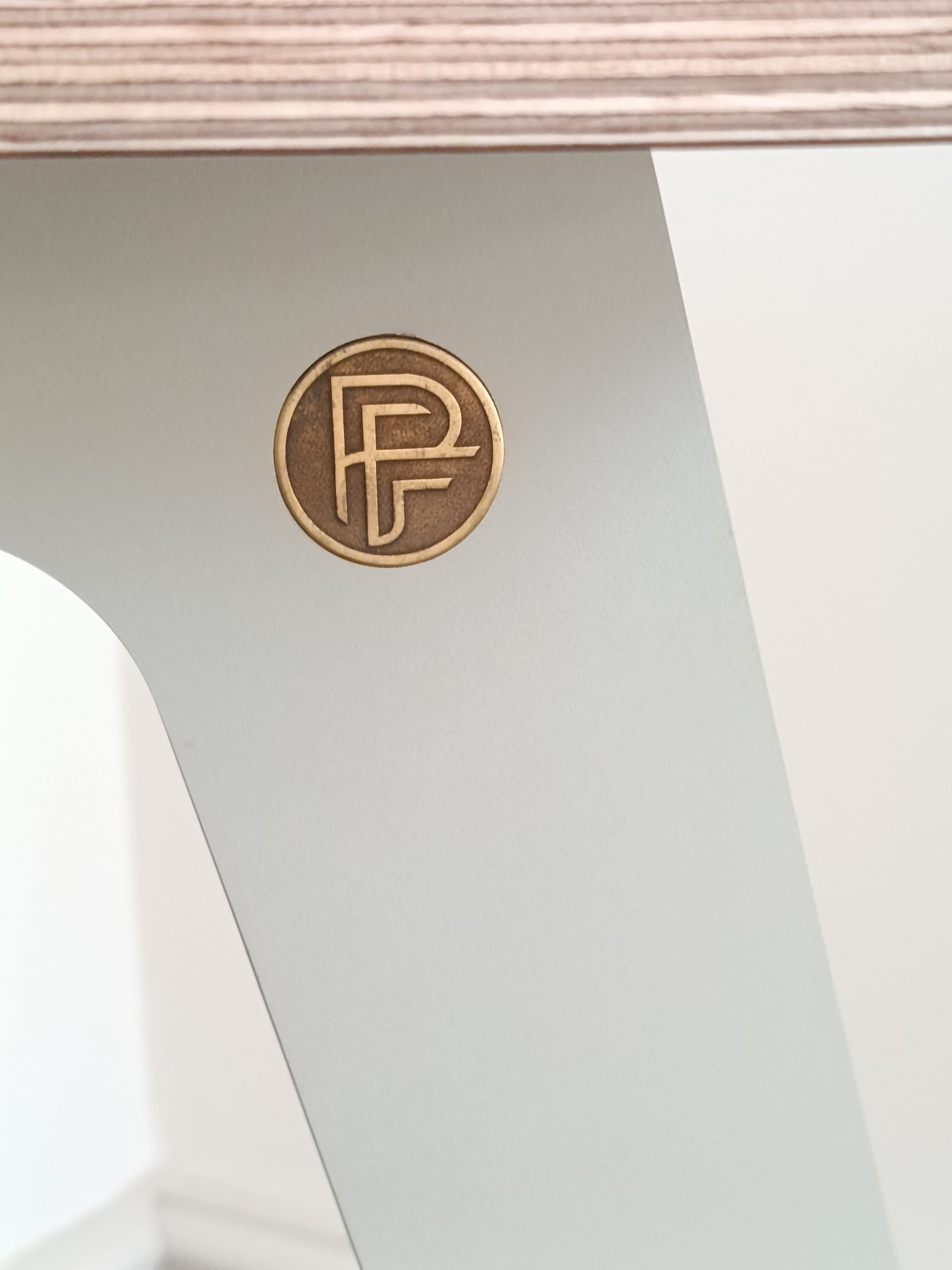 close up shot of the Ply-Fi logo badge flush fitted into every speaker stand.